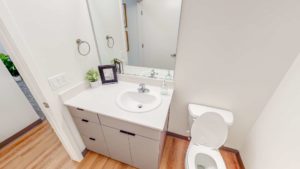 Apartment bathroom with vanity & mirror