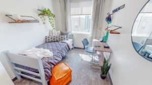 Student apartment bedroom with twin bed & desk