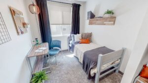 Student apartment bedroom with twin bed & desk